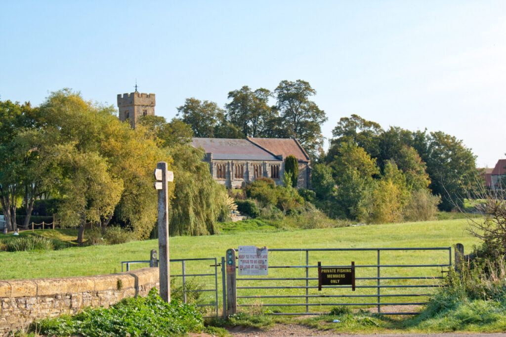 St Laurence Church with gate and style