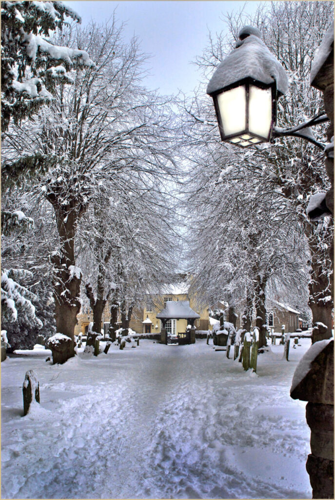 A snowy churchyard at St Laurence Church